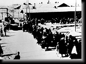 Jews being sent to their deaths in the gas chambers. Barracks in Sector BIb are visible in the background. * 760 x 553 * (44KB)